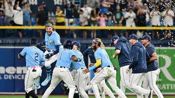 ST PETERSBURG, FLORIDA - SEPTEMBER 23: Josh Lowe #15 of the Tampa Bay Rays celebrates with teammates after hitting a walk-off RBI single in the ninth inning to defeat the Toronto Blue Jays 7-6 at Tropicana Field on September 23, 2023 in St Petersburg, Florida.   Julio Aguilar/Getty Images/AFP (Photo by Julio Aguilar / GETTY IMAGES NORTH AMERICA / Getty Images via AFP)