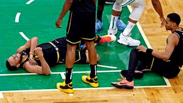 Jun 8, 2022; Boston, Massachusetts, USA; Golden State Warriors guard Stephen Curry (30) reacts to an apparent injury during the fourth quarter against the Boston Celtics in game three of the 2022 NBA Finals at TD Garden. Mandatory Credit: Winslow Townson-USA TODAY Sports