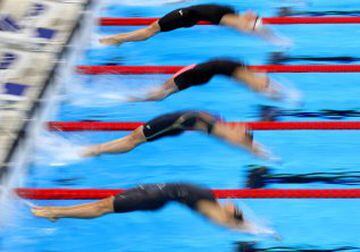 Kylie Masse of Canada, Anastasia Zueva of Russia and Kathleen Baker of the United States compete in the Women's 4 x 100m Medley Relay Final on Day 8 of the Rio 2016 Olympic Games at the Olympic Aquatics Stadium on August 13, 2016 in Rio de Janeiro, Brazil