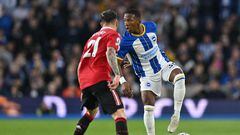 Brighton's Ecuadrorian defender Pervis Estupinan (R) vies with Manchester United's Brazilian midfielder Antony (L) during the English Premier League football match between Brighton and Hove Albion and Manchester United at the American Express Community Stadium in Brighton, southern England on May 4, 2023. (Photo by Glyn KIRK / AFP) / RESTRICTED TO EDITORIAL USE. No use with unauthorized audio, video, data, fixture lists, club/league logos or 'live' services. Online in-match use limited to 120 images. An additional 40 images may be used in extra time. No video emulation. Social media in-match use limited to 120 images. An additional 40 images may be used in extra time. No use in betting publications, games or single club/league/player publications. / 