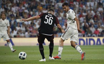 Dani Ceballos (right) fights for the ball with Milan's Stefan Simic.