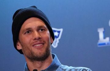 (FILES) In this file photo taken on January 31, 2019, New England Patriots quarterback Tom Brady talks to the press during a media availability in the Super Bowl Media Center at the World Congress Center in Atlanta, Georgia.