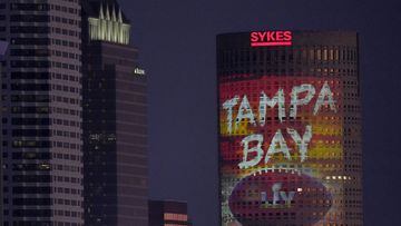 Signage for Super Bowl 55 is projected on a building in downtown Tampa, Fla. Thursday, Feb. 4, 2021. The city is hosting Sunday&#039;s Super Bowl NFL football game between the Tampa Bay Buccaneers and the Kansas City Chiefs. (AP Photo/Charlie Riedel)