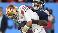 Dec 23, 2021; Nashville, Tennessee, USA; San Francisco 49ers quarterback Jimmy Garoppolo (10) is sacked by Tennessee Titans defensive end Denico Autry (96) during the first half at Nissan Stadium. Mandatory Credit: Christopher Hanewinckel-USA TODAY Sports