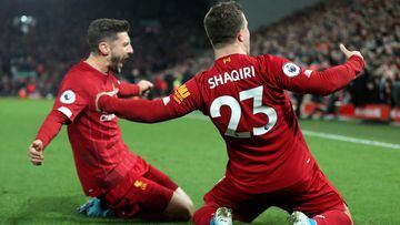 04 December 2019, England, Liverpool: Liverpool&#039;s Xherdan Shaqiri (R) celebrates scoring his side&#039;s second goal with teammate Adam Lallana during the English Premier League soccer match between Liverpool and Everton at Anfield stadium. Photo: Ri