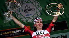 UAE Team Emirates team's Slovenian rider Tadej Pogacar celebrates on the podium after winning the 116th edition of the Giro di Lombardia (Tour of Lombardy), a 252,42 km cycling race from Bergamo to Como, in Como on October 8, 2022. (Photo by Marco BERTORELLO / AFP)