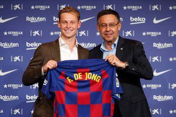 Frenkie de Jong and FC Barcelona president Josep Maria Bartomeu pose with the new FC Barcelona shirt as he is unveiled at Camp Nou stadium on July 05.