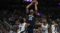 Feb 28, 2018; San Antonio, TX, USA; New Orleans Pelicans forward Anthony Davis (23) shoots against San Antonio Spurs guard Patty Mills (8) and forward Rudy Gay (22) during the second half at the AT&amp;T Center. The Pelicans won 121-116. Mandatory Credit: