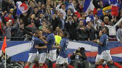 French midfielder Samir Nasri (2ndL) is congratulated by his team-mates after he converted a penalty kick during the UEFA Euro 2012 Group D qualifying football match France vs. Bosnia-Herzegovina at the Stade de France in Saint-Denis, a northern suburb of