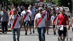 Fans of River Plate walk outside the stadium after the game was postponed.