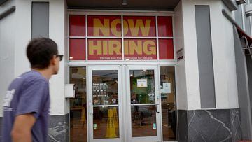 A &#039;&#039;Now Hiring&quot; sign hangs above the entrance to a McDonald&#039;s restaurant on November 05, 2021 in Miami Beach, Florida.
