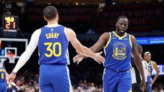 Oklahoma City, Oklahoma, USA; Golden State Warriors forward Draymond Green (23) and guard Stephen Curry (30) high five during the second quarter against the Oklahoma City Thunder at Paycom Center.