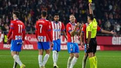 Girona's Dutch defender #17 Daley Blind receives a yellow card from Spanish referee Jesus Gil Manzano during the Spanish league football match between Girona FC and Real Sociedad at the Montilivi stadium in Girona on February 3, 2024. (Photo by Pau Barrena / AFP)