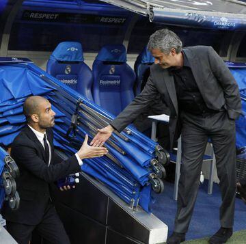 Pep Guardiola (left) and José Mourinho shake hands during their time as opposing coaches of Barcelona and Real Madrid, respectively.