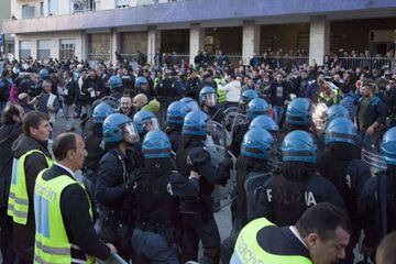 Riot police pulls out Napoli's fans at the arrival of Juventus football team before the Italian Serie A match.