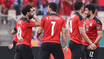 Egypt&#039;s forward Mohamed Salah (L) celebrates with teammates after scoring his team&#039;s first goal during the Africa Cup of Nations (CAN) 2021 quarter-final football match between Egypt and Morocco at Stade Ahmadou Ahidjo in Yaounde on January 30, 