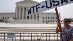 A demonstrator protests outside the U.S. Supreme Court as the court made their final rulings of their session on the issues of student loan forgiveness and LGBTQ rights in Washington, U.S. June 30, 2023.  REUTERS/Jim Bourg