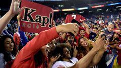 Colin Kaepernick poses for photos with fans in San Diego. 