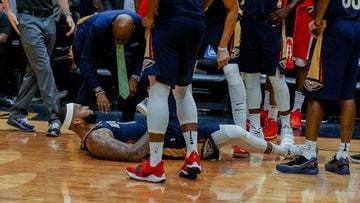 Jan 26, 2018; New Orleans, LA, USA; New Orleans Pelicans center DeMarcus Cousins (0) lays on the ground after suffering an apparent injury during the fourth quarter against the Houston Rockets at the Smoothie King Center. Pelicans defeated the Rockets 115