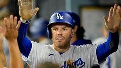 Aug 16, 2023; Los Angeles, California, USA;  Los Angeles Dodgers first baseman Freddie Freeman (5) is congratulated in the dugout after scoring a run in the sixth inning against the Milwaukee Brewers at Dodger Stadium. Mandatory Credit: Jayne Kamin-Oncea-USA TODAY Sports