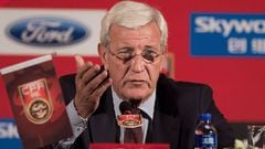 (FILES) This file photo taken on October 28, 2016 shows China&#039;s newly appointed national football team coach Marcello Lippi gesturing during a press conference in Beijing. Marcello Lippi said on November 14, 2016, China need to shed their &quot;unde