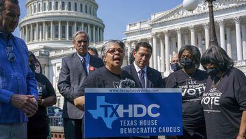 Texas state Rep. Senfronia Thompson, dean of the Texas House of Representatives, is joined by Sen. Jeff Merkley, D-Ore., left center, and other Texas Democrats, as they continue their protest of restrictive voting laws, at the Capitol in Washington, Friday, Aug. 6, 2021. (AP Photo/J. Scott Applewhite)