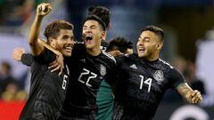 CHICAGO, ILLINOIS - JULY 07: Jonathan dos Santos #6, Uriel Antuna #22, and Alexis Vega #14 of the Mexico celebrate after beating the United States 1-0 in the 2019 CONCACAF Gold Cup Final at Soldier Field on July 07, 2019 in Chicago, Illinois.   Dylan Buell/Getty Images/AFP == FOR NEWSPAPERS, INTERNET, TELCOS &amp; TELEVISION USE ONLY ==