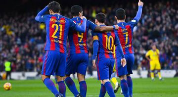 Ardan Turan (R) of FC Barcelona celebrates with his team mates (L-R) Andre Gomes, Luis Suarez and Lionel Messi after scoring his team's fourth goalduring the La Liga match between FC Barcelona and UD Las Palmas