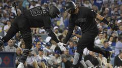 LOS ANGELES, CA - AUGUST 23: Didi Gregorius #18 of the New York Yankees congratulates Gary Sanchez #24 of the New York Yankees for his solo home run in the thrid inning against Hyun-Jin Ryu #99 of the Los Angeles Dodgers at Dodger Stadium on August 23, 20