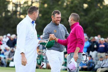 Lee Westwood of England and Sergio Garcia of Spain embrace on the 18th green during the first round of the 2017 Masters.