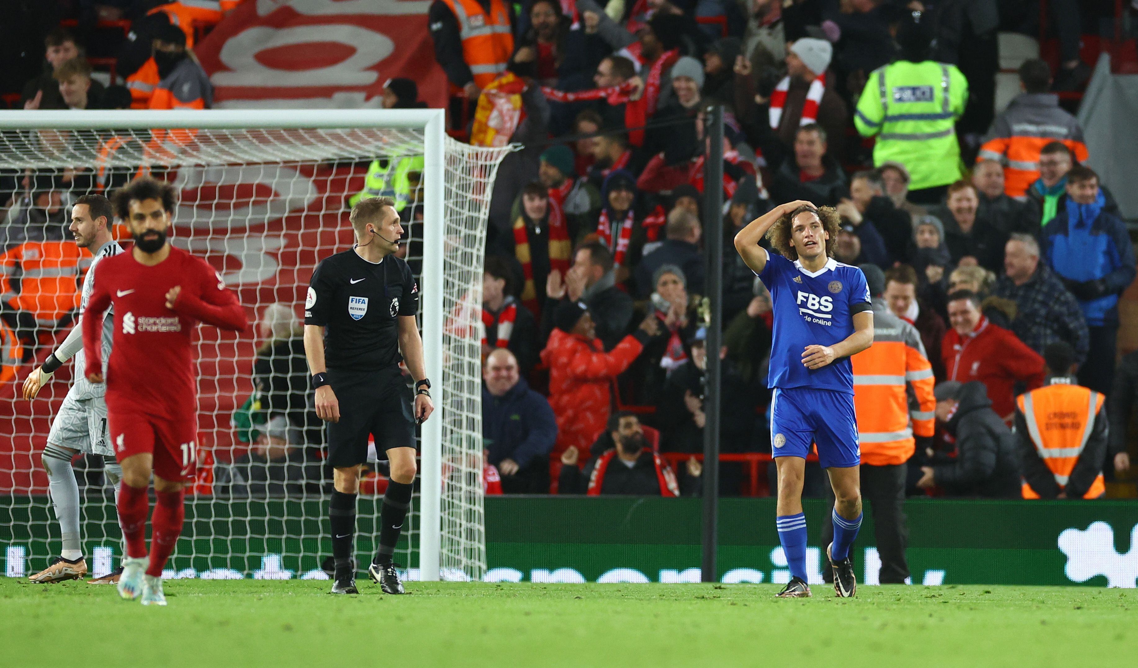 Soccer Football - Premier League - Liverpool v Leicester City - Anfield, Liverpool, Britain - December 30, 2022 Leicester City's Wout Faes reacts after scoring an own goal and Liverpool's first as Danny Ward and referee Craig Pawson look on REUTERS/Carl Recine EDITORIAL USE ONLY. No use with unauthorized audio, video, data, fixture lists, club/league logos or 'live' services. Online in-match use limited to 75 images, no video emulation. No use in betting, games or single club /league/player publications.  Please contact your account representative for further details.