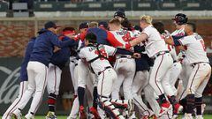 ATLANTA, GEORGIA - OCTOBER 16: Austin Riley #27 of the Atlanta Braves celebrates with teammates after hitting a walk-off RBI single off Blake Treinen #49 of the Los Angeles Dodgers during the ninth inning of Game One of the National League Championship Se
