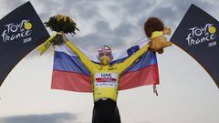 Cycling - Tour de France - Stage 21 - Mantes-la-Jolie to Paris Champs-Elysees - France - September 20, 2020. UAE Team Emirates rider Tadej Pogacar of Slovenia celebrates on the podium, after winning the general classification and the overall leader&#039;s