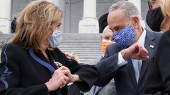 House Speaker Nancy Pelosi and Senate Minority Leader Chuck Schumer share an elbow greeting following ceremonies honoring late Supreme Court Justice Ruth Bader Ginsburg at the US Capitol in Washington.