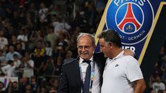 Luis Campos (L), Portuguese Football Advisor for French club Paris Saint-Germain, celebrates with Paris Saint-Germain's French head coach Christophe Galtier after the team won the French Champions' Trophy (Trophee des Champions) final football match, Paris Saint-Germain versus FC Nantes, in the at the Bloomfield Stadium, in Tel Aviv on July 31, 2022. - Paris Saint-Germain (PSG) beat Nantes 4-0 to clinch the trophy. (Photo by JACK GUEZ / AFP)