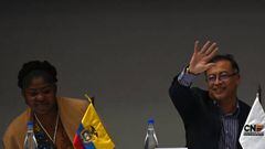 Colombian president-elect Gustavo Petro (R) waves next to his running mate Francia Marquez on arrival at the headquarters of the National Registry of Civil Status to receive their official credentials as president and vice-president respectively, in Bogota on June 23, 2022. - Petro, who became the country's first ever left-wing president after getting 50.44 percent of the vote in the runoff election, has promised to invest in healthcare and education, increase taxes on the wealthiest and suspend oil exploration, giving pride of place to renewable energy sources. (Photo by Juan BARRETO / AFP) (Photo by JUAN BARRETO/AFP via Getty Images)
