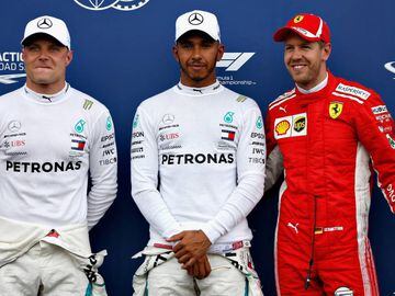 LE CASTELLET, FRANCE - JUNE 23:  Top three qualifiers Lewis Hamilton of Great Britain and Mercedes GP, Valtteri Bottas of Finland and Mercedes GP and Sebastian Vettel of Germany and Ferrari celebrate in parc ferme during qualifying for the Formula One Gra