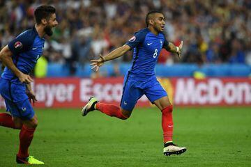 Payet (right) celebrates his winning goal against Romania.