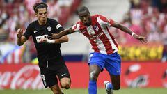 Atletico Madrid&#039;s Geoffrey Kondogbia, right, duels for the ball with Elche&#039;s Pere Milla during the Spanish La Liga soccer match between Atletico Madrid and Elche at Wanda Metropolitano stadium in Madrid, Spain, Sunday, Aug. 22, 2021. (AP Photo/J