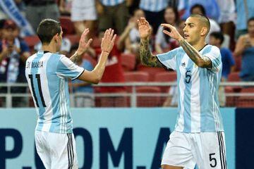 Leandro Paredes of Argentina (right) celebrates with Ángel di María after scoring against Singapore.