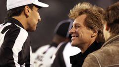 EAST RUTHERFORD - NOVEMBER 13: Singer Jon BonJovi, right, chats with referee Gene Steratore, left, on the sidelines before the game. The New England Patriots visited the New York Jets in a regular season NFL game at MetLife Stadium. (Photo by Jim Davis/Th