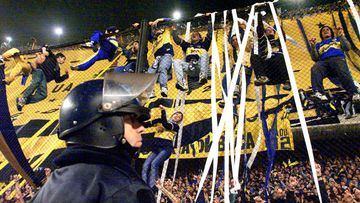 A policeman keeps watch over fans of Argentina&#039;s Boca Juniors 