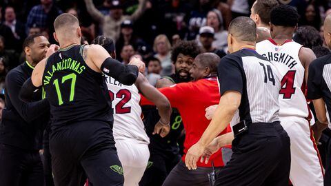 Feb 23, 2024; New Orleans, Louisiana, USA;  Miami Heat forward Jimmy Butler (22) and New Orleans Pelicans forward Naji Marshall (8) and guard Jose Alvarado (15) are ejected after a melee due to a play during the second half at Smoothie King Center. Mandatory Credit: Stephen Lew-USA TODAY Sports