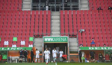 AUGSBURG, GERMANY - MAY 16: Players of FC Augsburg enters the pitch during the Bundesliga match between FC Augsburg and VfL Wolfsburg at WWK-Arena on May 16, 2020 in Augsburg, Germany. The Bundesliga and Second Bundesliga is the first professional league 