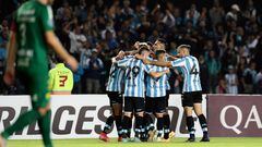 Argentina's Racing Carlos Alcaraz (covered) celebrates with teammates after scoring a goal against Brazil's Cuiaba during their Copa Sudamericana group stage first leg football match at the Presidente Juan Domingo Peron stadium in Buenos Aires, on April 13, 2022. (Photo by ALEJANDRO PAGNI / AFP)