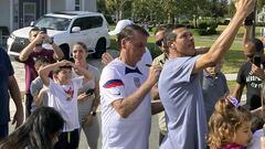 Former Brazil President Jair Bolsonaro, center, meets with supporters outside a vacation home where he is staying near Orlando, Fla., on Wednesday, Jan. 4, 2023. (Skyler Swisher/Orlando Sentinel via AP)
