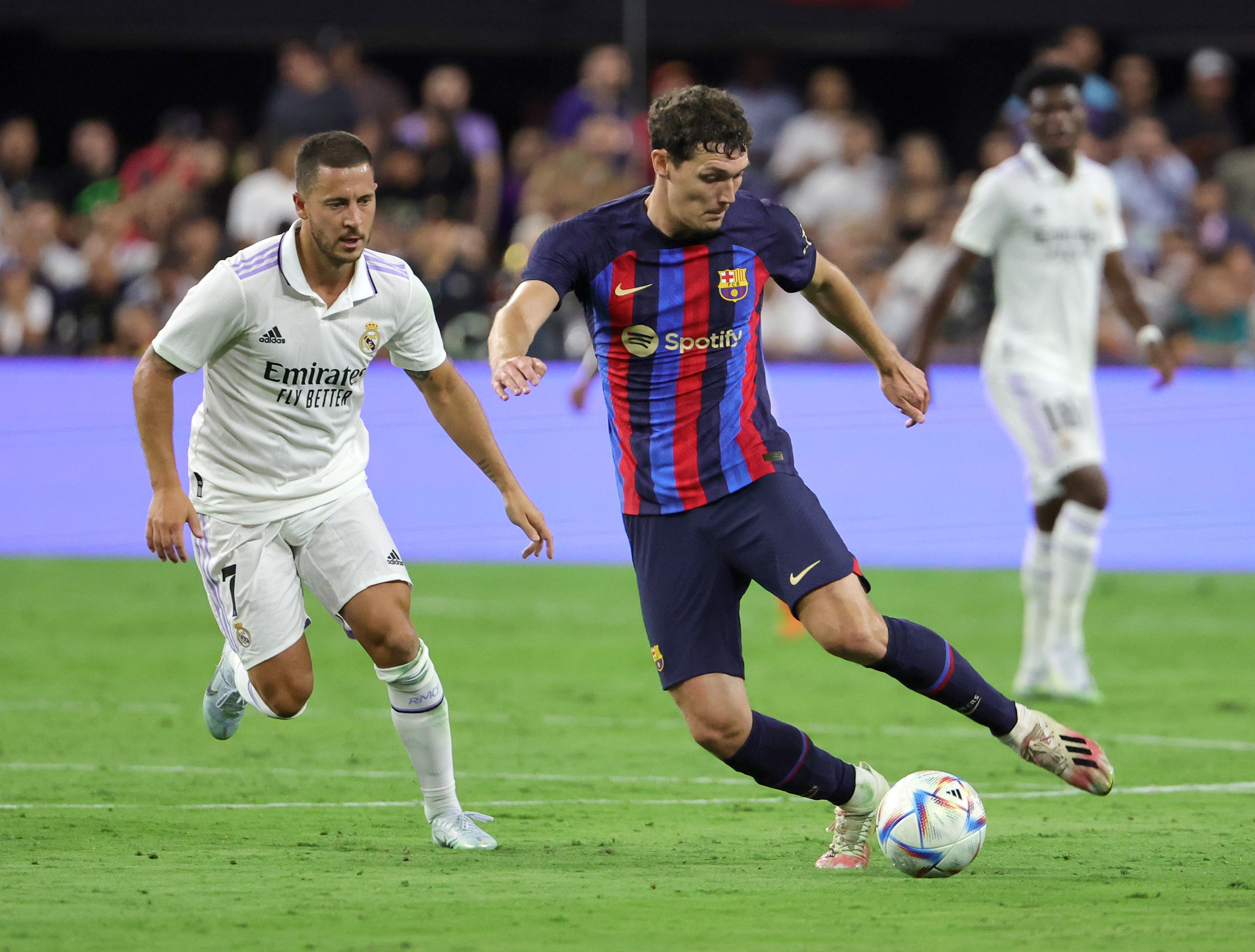 LAS VEGAS, NEVADA - JULY 23: Andreas Christensen #15 of Barcelona dribbles the ball under pressure from Eden Hazard #7 of Real Madrid during their preseason friendly match at Allegiant Stadium on July 23, 2022 in Las Vegas, Nevada. Barcelona defeated Real Madrid 1-0.   Ethan Miller/Getty Images/AFP
== FOR NEWSPAPERS, INTERNET, TELCOS & TELEVISION USE ONLY ==