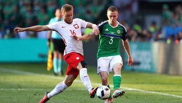 NICE, FRANCE - JUNE 12: Jakub Blaszczykowski of Poland and Shane Ferguson of Northern Ireland compete for the ball during the UEFA EURO 2016 Group C match between Poland and Northern Ireland at Allianz Riviera Stadium on June 12, 2016 in Nice, France.  (Photo by Lars Baron/Getty Images)