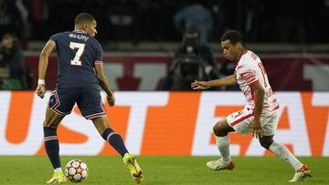 PSG&#039;s Kylian Mbappe is closed down by Leipzig&#039;s Tyler Adams during the Champions League group A soccer match between Paris Saint Germain and RB Leipzig at the Parc des Princes stadium in Paris, Tuesday, Oct. 19, 2021. (AP Photo/Francois Mori)