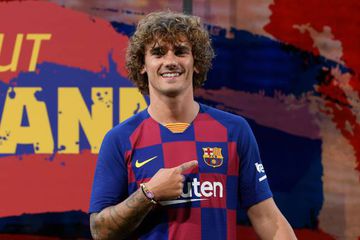 Griezmann poses in the Barcelona shirt during his official presentation at the Camp Nou.